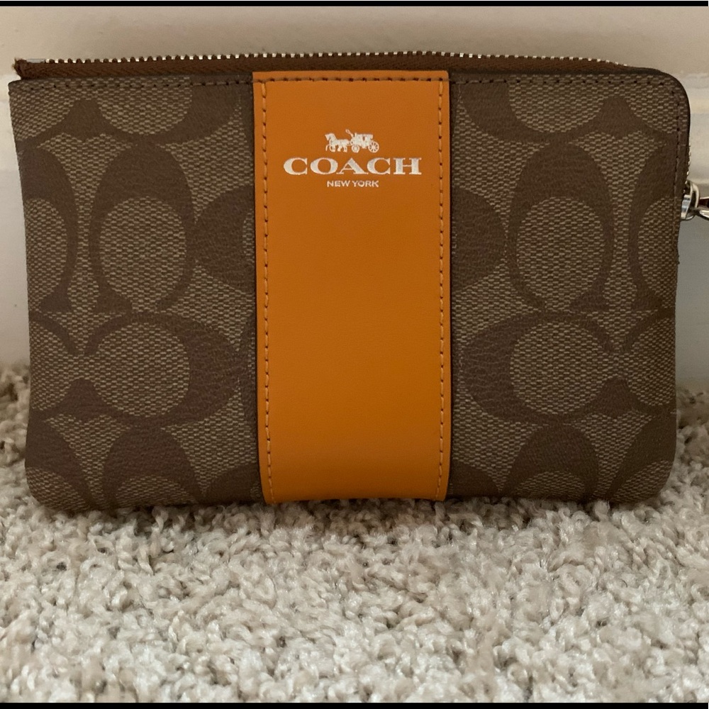 COACH corner zip wristlet in signature canvas